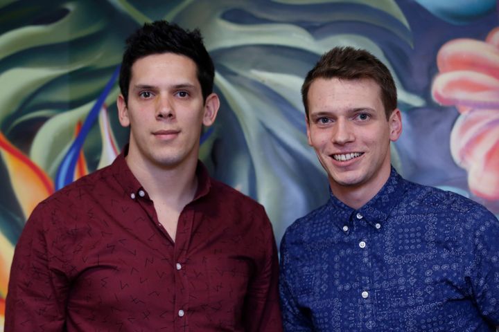 Brothers Rob (L) and Paul Forkan, creators of Gandys flip-flops, pose for a photograph at their offices in London December 19, 2014.