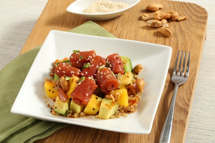 Fresh & Co's Poke Side Salad with cucumber, mango, avocado, red onion, quinoa, cashews and sesame oil