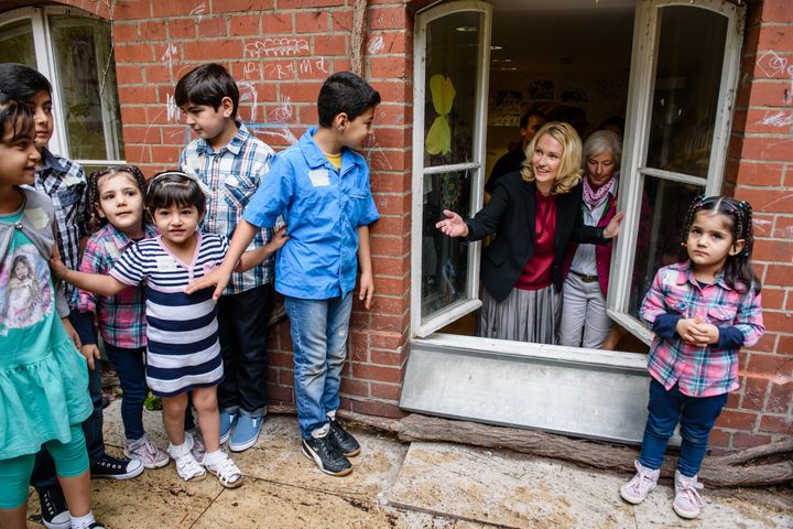 Germany's family minister Manuela Schwesig (center) visits a Red Cross shelter in Berlin.