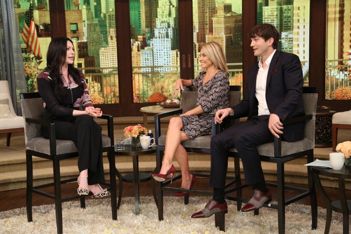 Kelly Ripa with co-host Ashton Kutcher and guest Laura Prepon on Oct. 7.