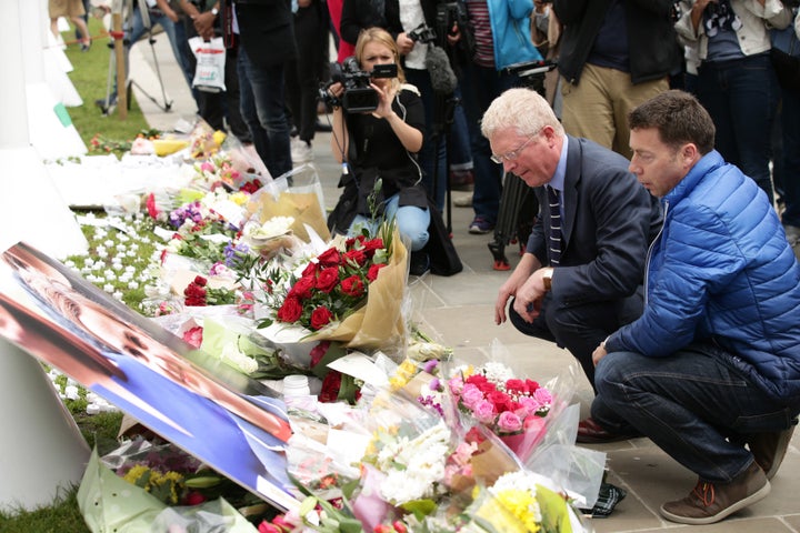 John Cryer (kneeling left, pictured with party general secretary Iain McNicol, right)