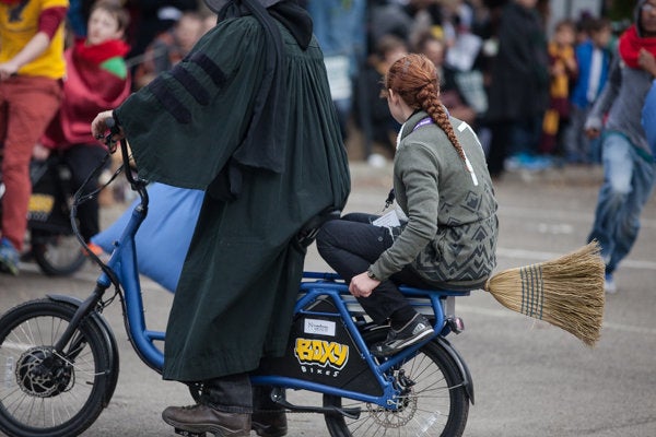 A quidditch match is played on motorized bikes. 