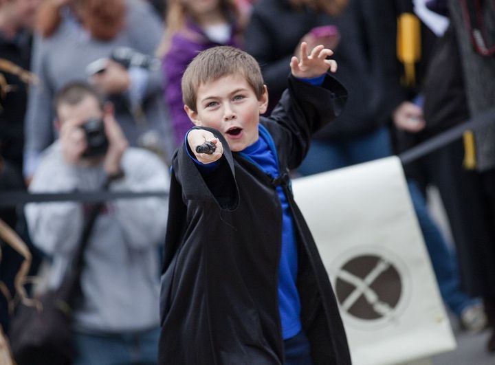 A young wizard displays his wand during last year's Wizarding Weekend in Ithaca, New York.
