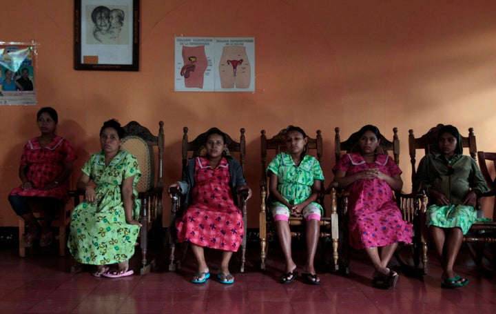 Pregnant teenagers sit inside a maternity home in Jinotega city, some 160 km (99 miles) north of Managua October 24, 2013. Ac