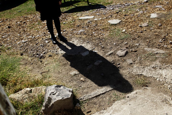 A schoolgirl casts her shadow on a dirt floor while talking to Reuters about having been sexually abused in Ecatepec, Mexico.