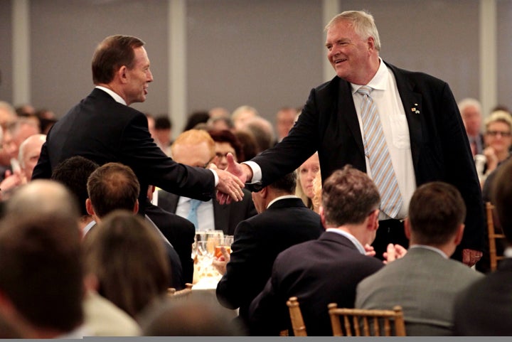 Australian Prime Minister Tony Abbott greets Australian Ambassador to the U.S. Kim Beazley in 2014.