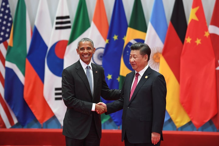 China's President Xi Jinping shakes hands with U.S. President Barack Obama before the G20 leaders' family photo in Hangzhou o
