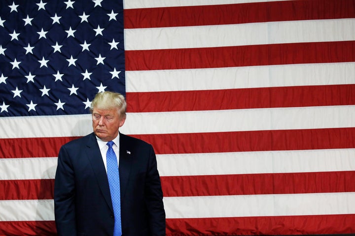 Republican presidential nominee Donald Trump pauses as he speaks at a campaign town hall event in Sandown, New Hampshire, on Thursday.