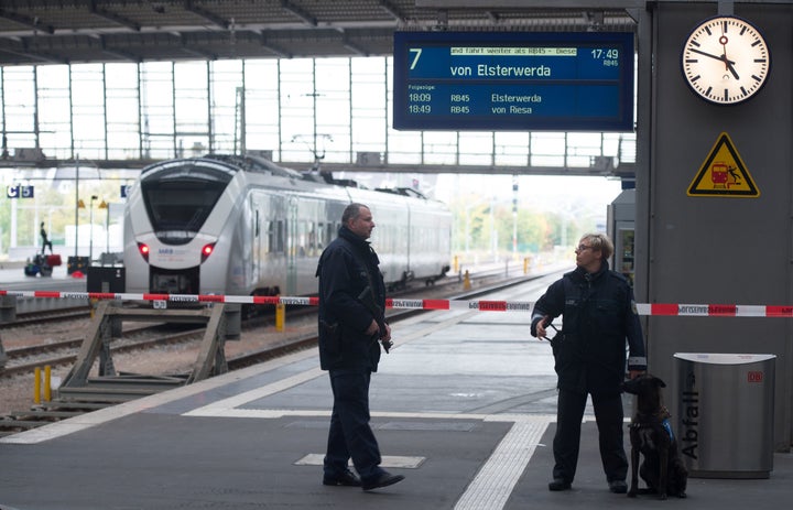 <strong>Policemen secure the area on a platform of the train station in Chemnitz, eastern Germany.</strong>