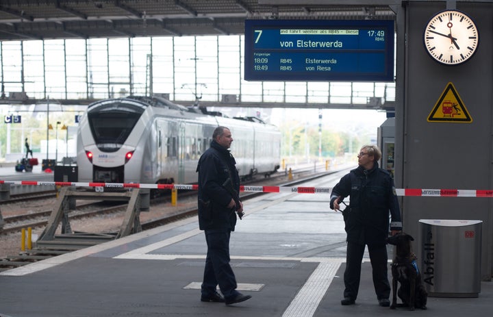 Policemen secure the area on a platform of the train station in Chemnitz, eastern Germany.