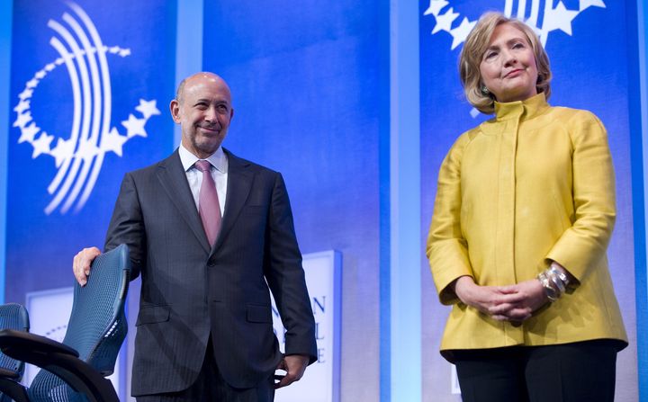 Hillary Clinton stands alongside Lloyd Blankfein, CEO of Goldman Sachs in Sep. 2014. Clinton's ties and paid speeches to major financial institutions have drawn scrutiny.