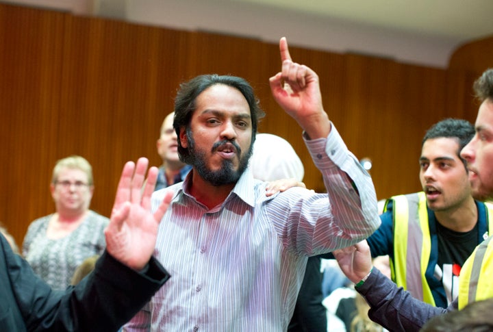 A man heckles Labour leader Jeremy Corby.