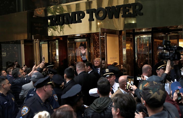 Donald Trump waves to supporters outside Trump Tower on Saturday.