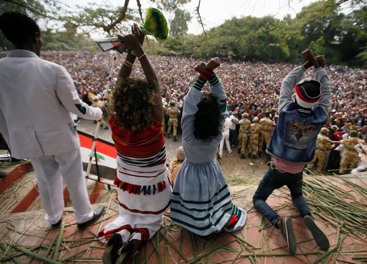 Demonstrators chant slogans while flashing the Oromo protest gesture during Irreecha, the thanksgiving festival of the Oromo people, in Bishoftu town, Oromia region, Ethiopia, October 2, 2016.