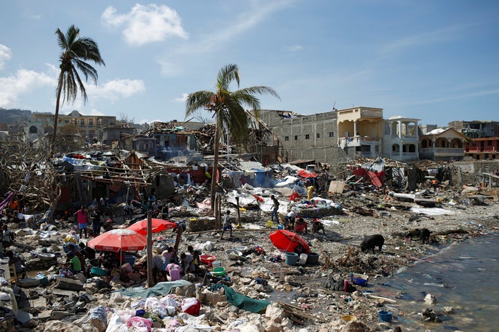 People gather at the shore after Hurricane Matthew passes in Jeremie, Haiti, October 8, 2016