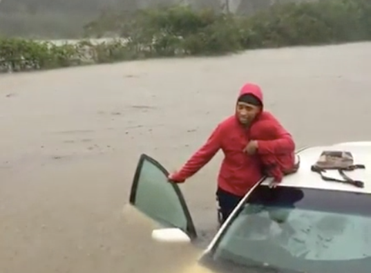 Mother and child wait for help in Fayetteville, N.C.