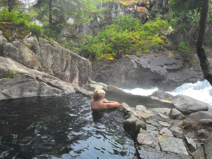 The natural hot spring overlooking the rapids