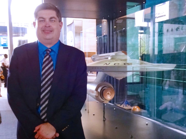 S. Daniel Carter with the original filming model of the U.S.S. Enterprise at the National Air and Space Museum in Washington,