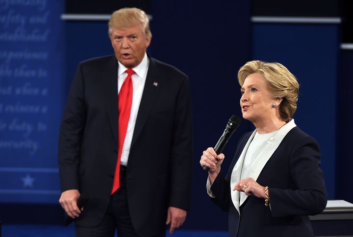 US Democratic presidential candidate Hillary Clinton and US Republican presidential candidate Donald Trump debate during the second presidential debate at Washington University in St. Louis, Missouri, on October 9, 2016