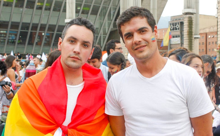 José Rollano and Pedro Fajardo join marchers in Medellín's Park of Lights on October 7 because they believe "peace is now the responsibility of all Colombians."