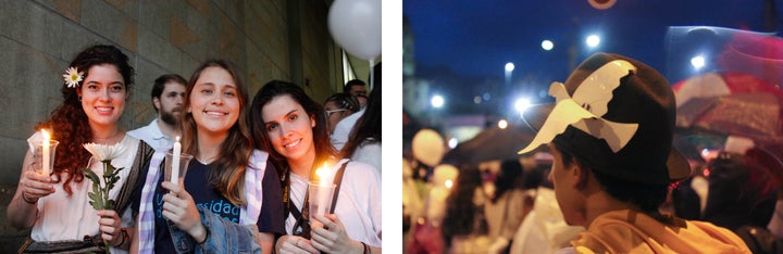 Pro-peace supporters held white candles and flowers representative of peace and one marcher secured a white peace dove to his hat during an October 7 march for peace in Medellín, Colombia.