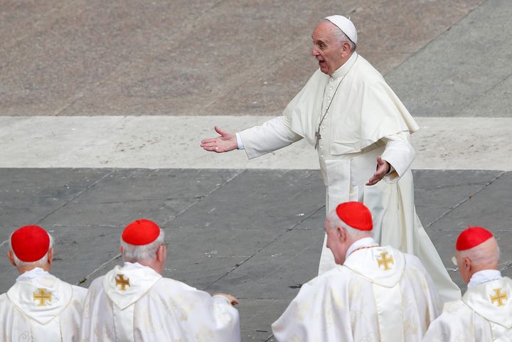 Pope Francis reacts as he is greeted by Cardinals at the end of a mass for the Jubilee of Priests at St. Peter's Square at the Vatican June 3.