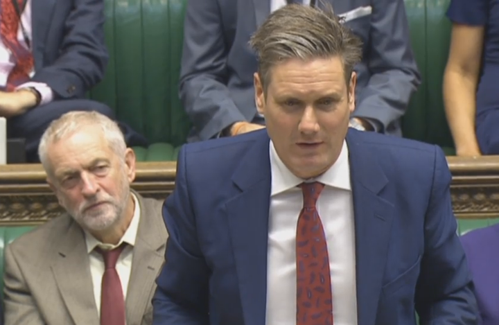 Jeremy Corbyn (left) fails to nod behind Shadow Brexit Secretary Sir Keir Starmer in parliament today