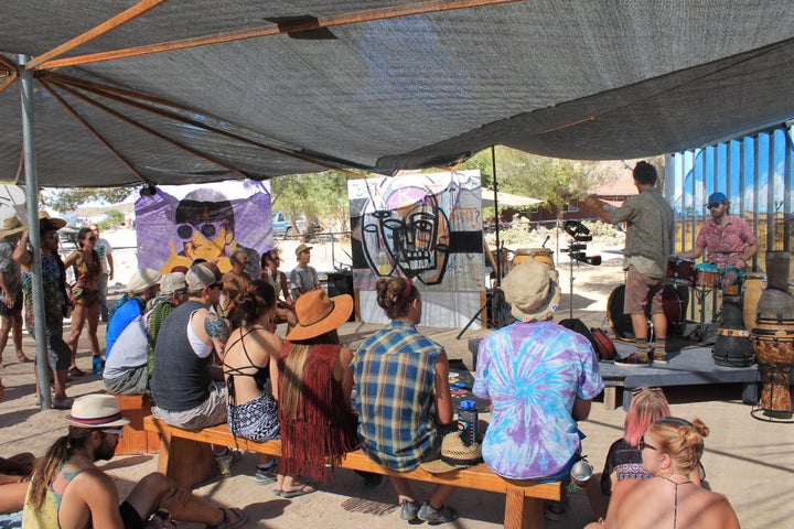 Festival-goers listening to music in the "Positive Vibration Station."