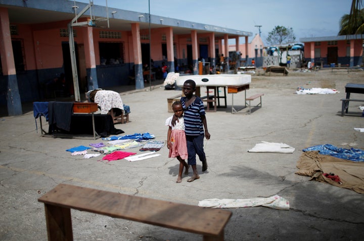 Children walk at a shelter after Hurricane Matthew passes in Jeremie, Haiti, October 9, 2016.