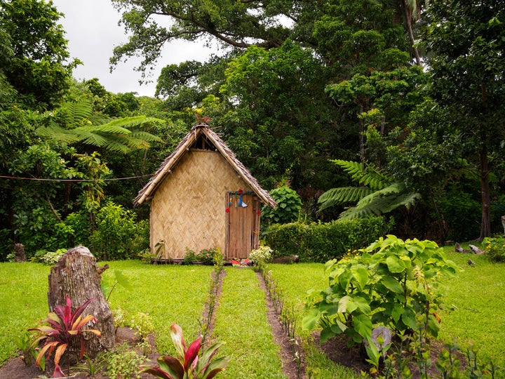 A traditional thatched bungalow in a local village.