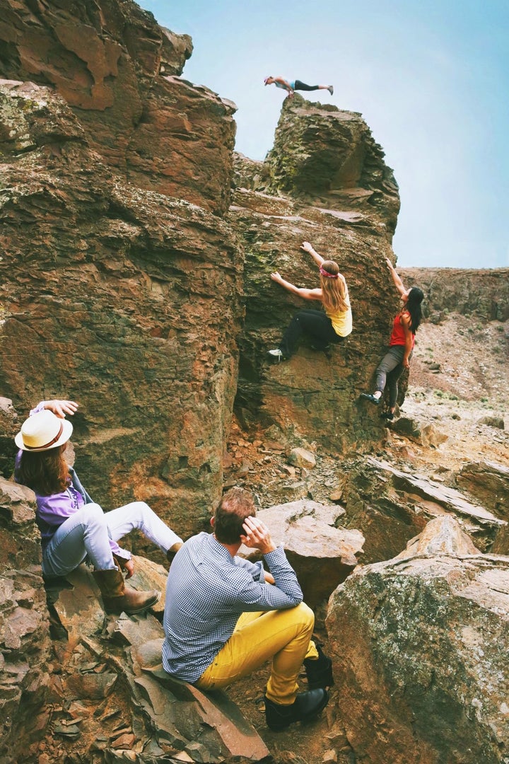 In Outdoor Research's photo spread, the women are the ones who expertly scale the steep boulders while their "adorable" male friends watch from the sidelines.