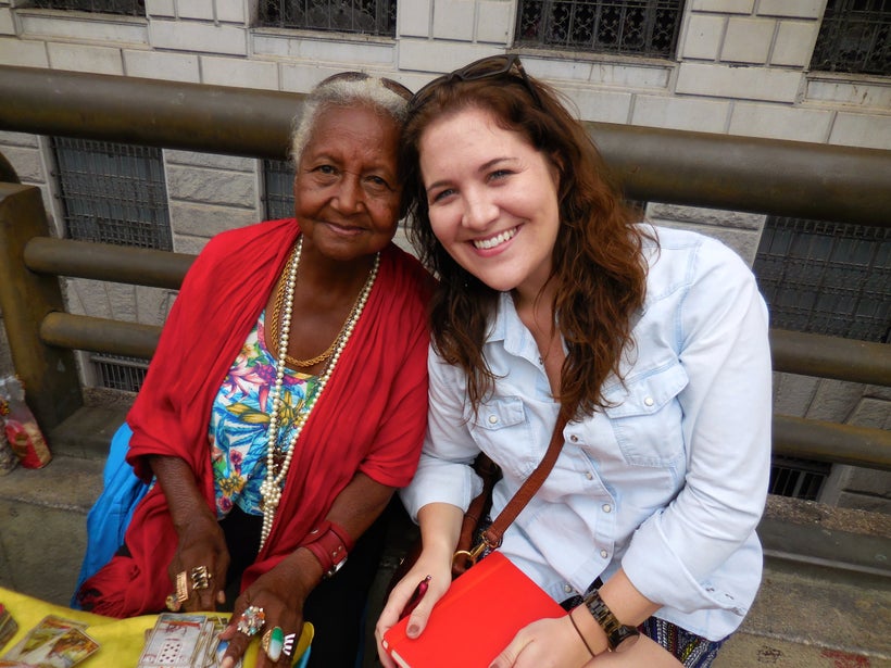 Asking the Big Shared World questions of a tarot card reader in downtown Brazil, who also answered her three questions. Fortu