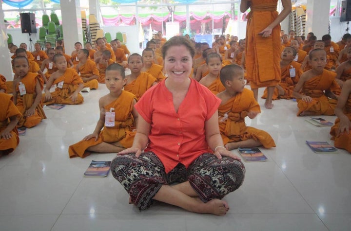 Sitting with a group of young Buddhists in Bangkok, Thailand. While spending the day with a local tour guide, we biked through the bustling downtown city center, local markets, and even came across a Buddhist community on a backroad of a Bangkok neighborhood. They welcomed me in, the elder monks answered the three questions, and in the end asked me to share my experience with the young boys.