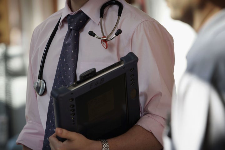 A doctor at The Queen Elizabeth Hospital Birmingham does his rounds