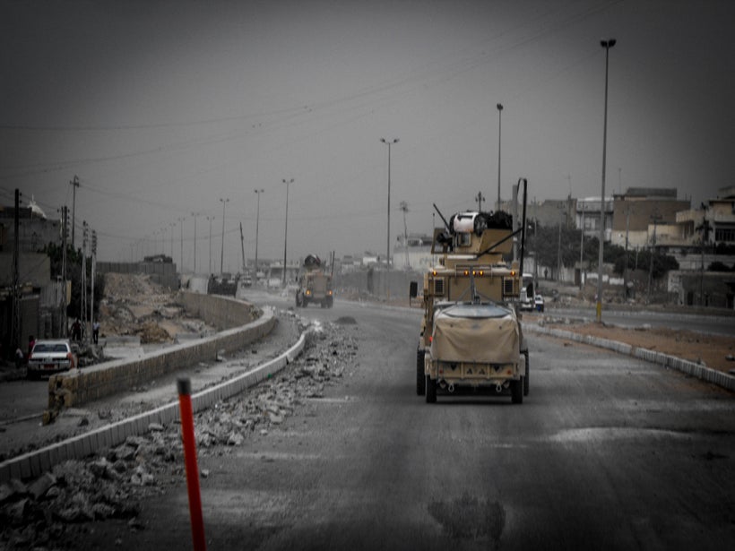 A US convoy rolling through the streets of Mosul in 2008