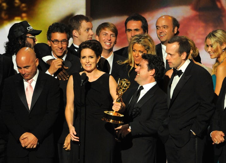 Tina Fey and the cast of "30 Rock" accepting the Emmy award for Outstanding Comedy Series in 2009. The series won a total of 11 Primetime Emmy awards.