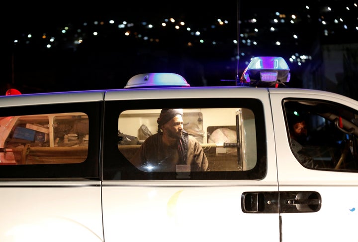 An Afghan man sits inside an ambulance after an attack in Kabul, Afghanistan October 11, 2016.