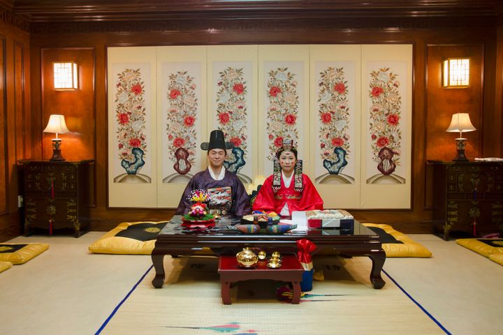 A couple poses in a traditional wedding hall in Anyang, South Korea.