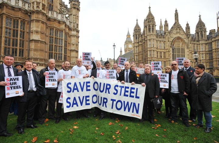 Members of the Unite union and steel workers from the Tata factory in Corby gather in Parliament Square