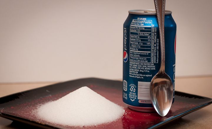 A 12-ounce can of regular soda contains 39 grams of total sugar, which is about 9 1/3 teaspoons of sugar and more than the recommended daily healthy limit for adults.
