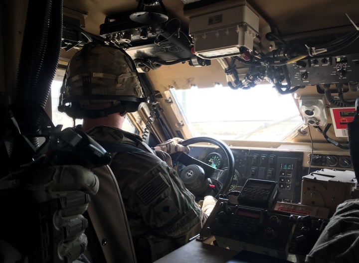 U.S. troops drive through Qayyarah Airfield West in a Mine Resistant Ambush Protected vehicle on Oct. 7.