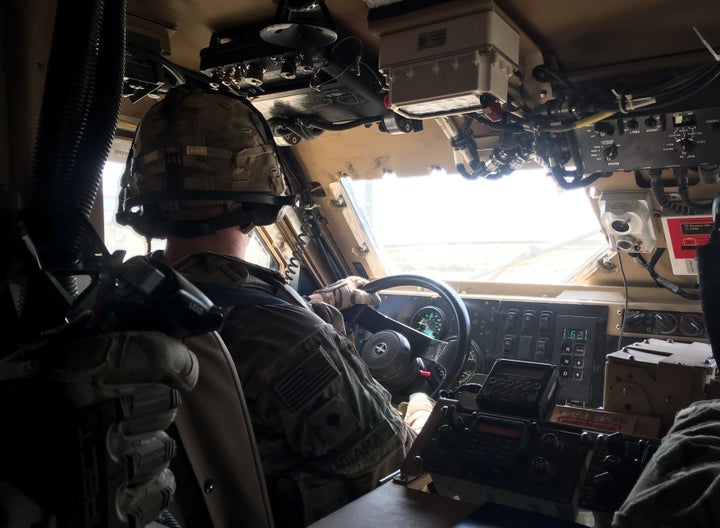 U.S. troops drive through Qayyarah Airfield West in a Mine Resistant Ambush Protected vehicle on Oct. 7. 