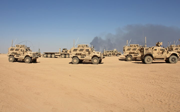 Mine-resistant vehicles based at Qayyarah Airfield West, which will be a key staging area for U.S. and allied 