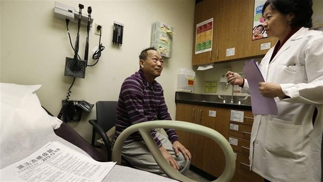 A Vietnamese-speaking patient receives a checkup in Seattle. A new federal rule requires hospitals and other health care prov