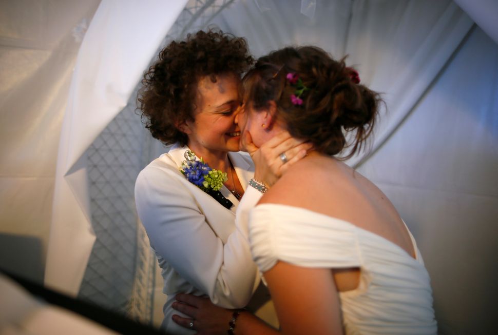 Anne Austin, 28, and Jen Durham, 30, kiss as they get married in West Hollywood, California, on July 1, 2013.
