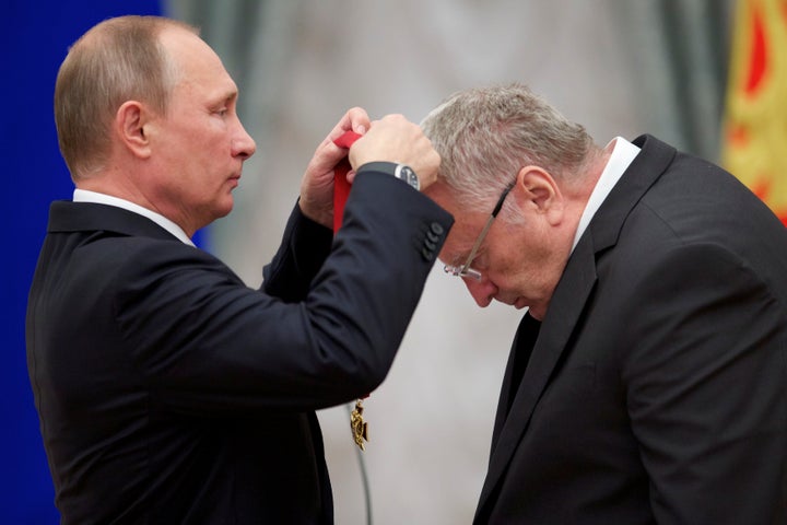 Russian President Vladimir Putin (L) awards head of the Liberal Democratic Party of Russia (LDPR) Vladimir Zhirinovsky.