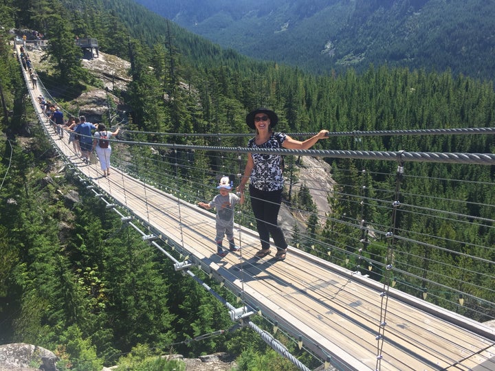 Walking across the bridge at the summit of the Sea to Sky Gondola in Squamish, BC.