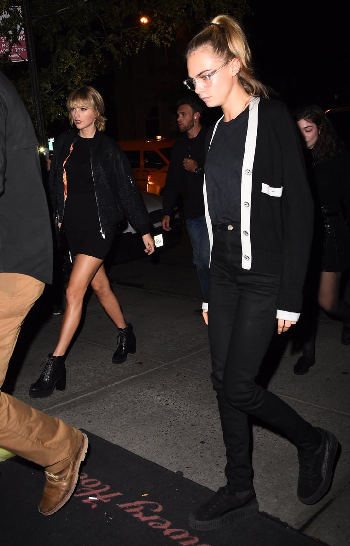 Taylor Swift and Cara Delevingne in matching get-ups. 