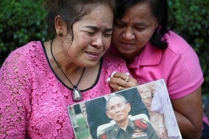 Well-wishers weep and pray for Thailand's King Bhumibol Adulyadej at the Siriraj hospital where he died.