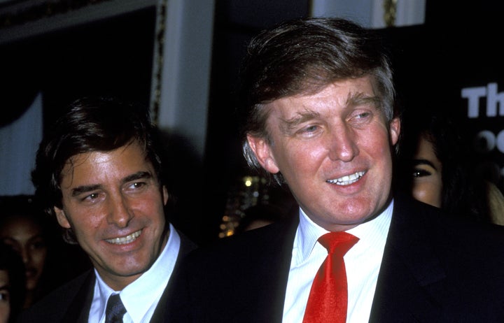 Donald Trump (right) pictured with modeling agent John Casablancas in 1991. One woman said she attended a dinner with both men in 1996, where Trump looked up models' skirts and commented on their underwear.